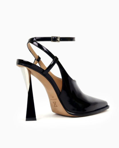 Maia black patent leather cutout pump with ankle strap and sculptural geometric heel, angled side view