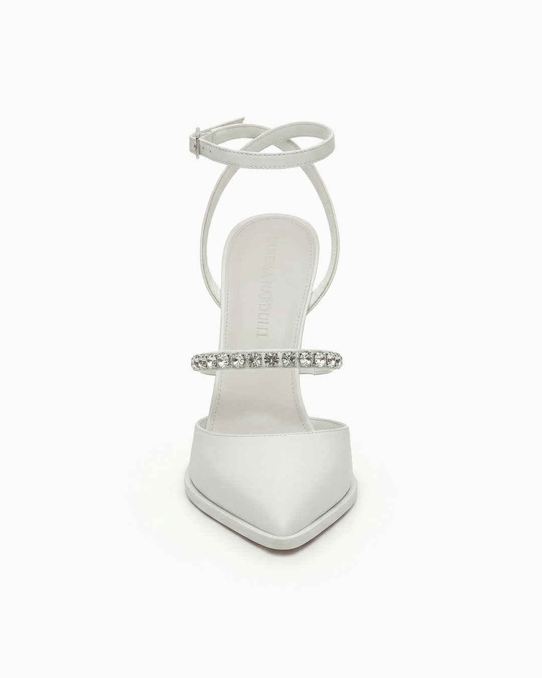 White pointed-toe heels with ankle strap and crystals, front view